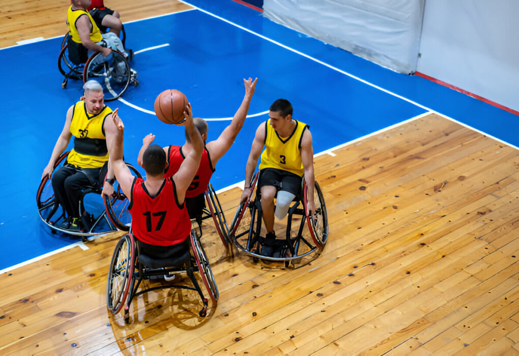 wheelchair basketball players in action during the Paris 2024 Paralympics, showcasing athletes skillfully maneuvering on the court in their wheelchairs amidst a vibrant, competitive atmosphere.