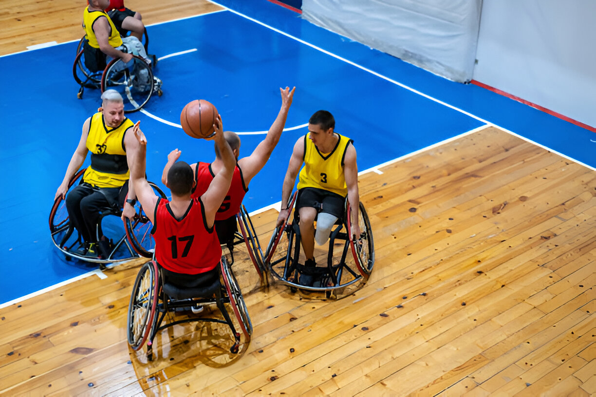 wheelchair basketball players in action during the Paris 2024 Paralympics, showcasing athletes skillfully maneuvering on the court in their wheelchairs amidst a vibrant, competitive atmosphere.